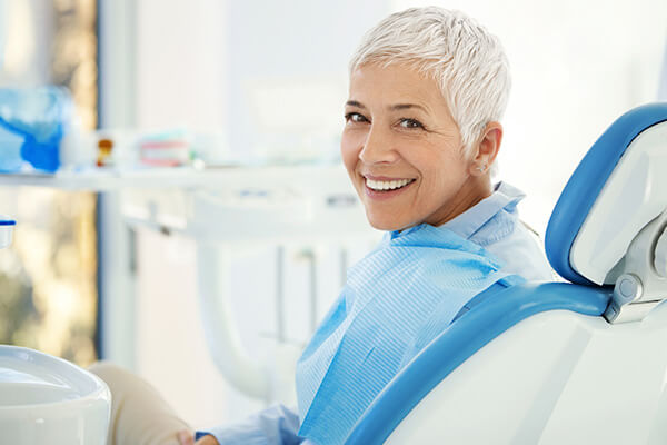 Older woman smiling at the dentist